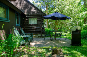 Cole Cabin pond-side patio with propane fired barbecue.
